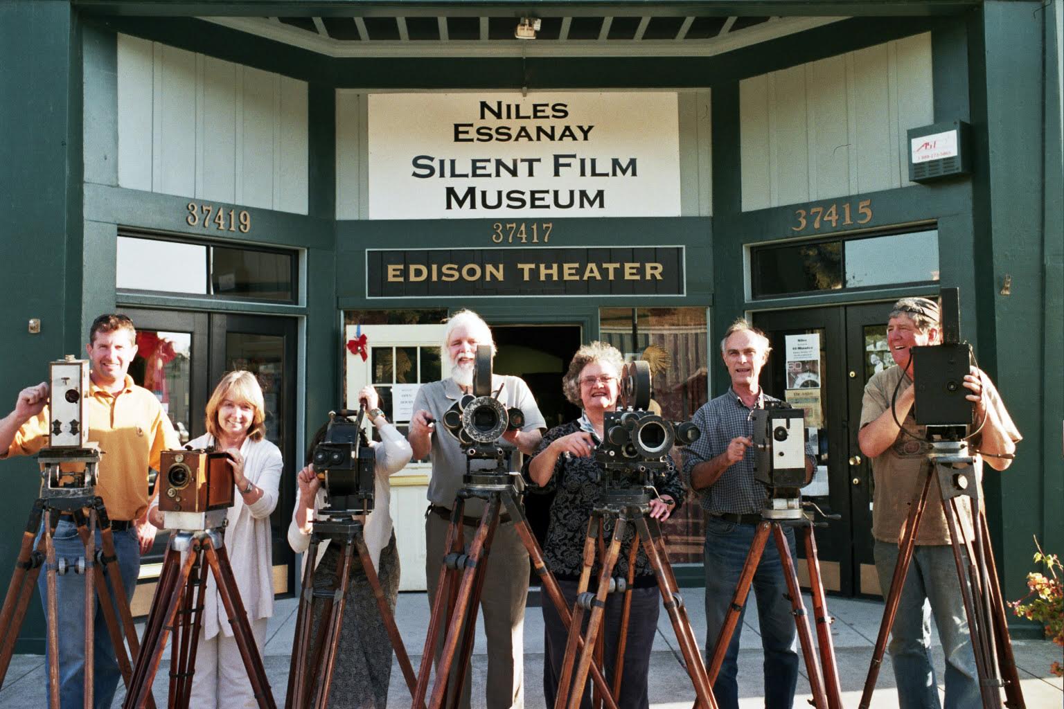 David Kiehn (second from right) and others, showing some of the Niles Essanay Silent Film Museum's silent-era camera equipment