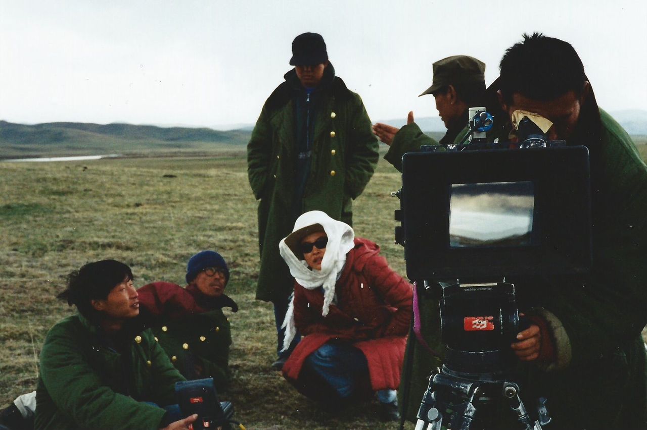 Joan Chen and crew on location shooting "Xiu Xiu"