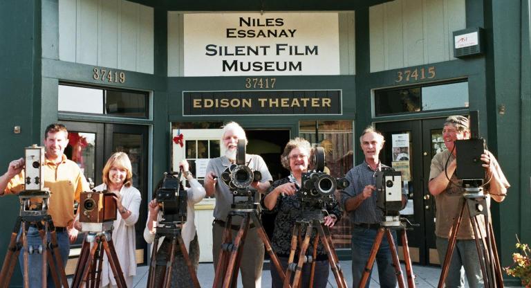 David Kiehn (second from right) and others, showing some of the Niles Essanay Silent Film Museum's silent-era camera equipment